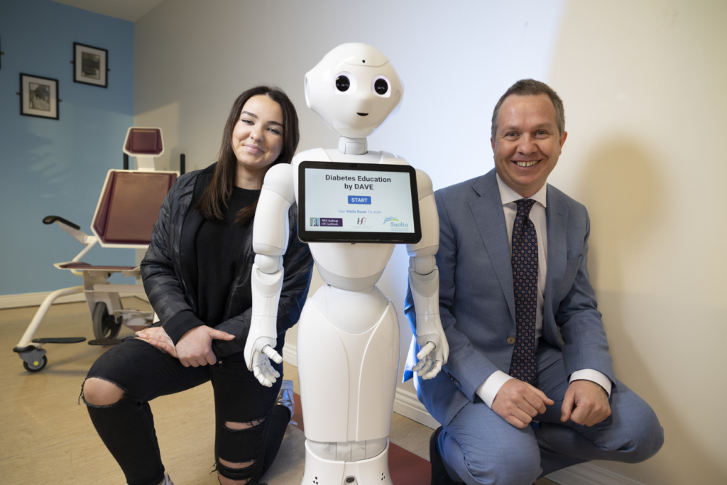 Diabetes patient and project participant Abigail with Dave the Robot and Prof Derek O'Keeffe