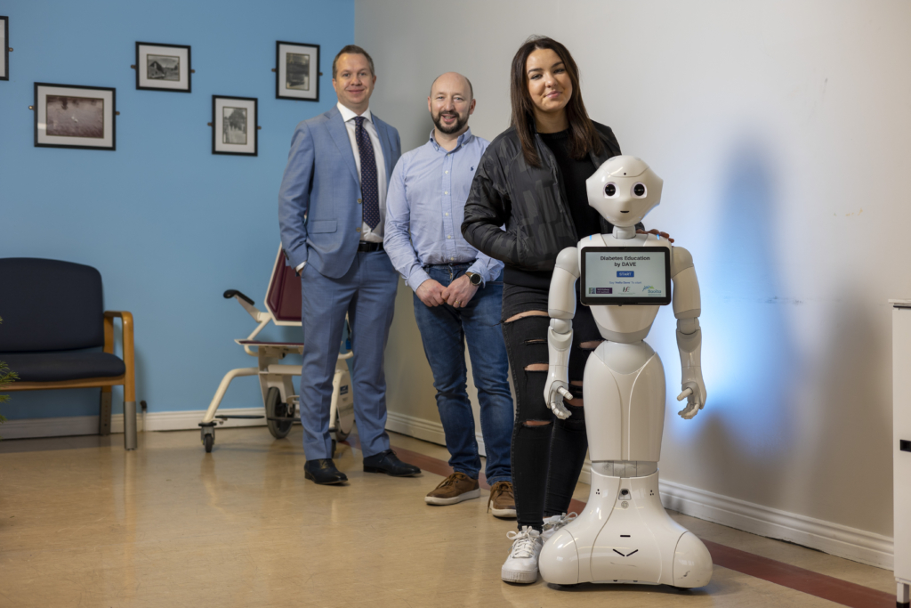 Diabetes patient and project participant Abigail with Dave the Robot, her dad Mark and Prof Derek O'Keeffe